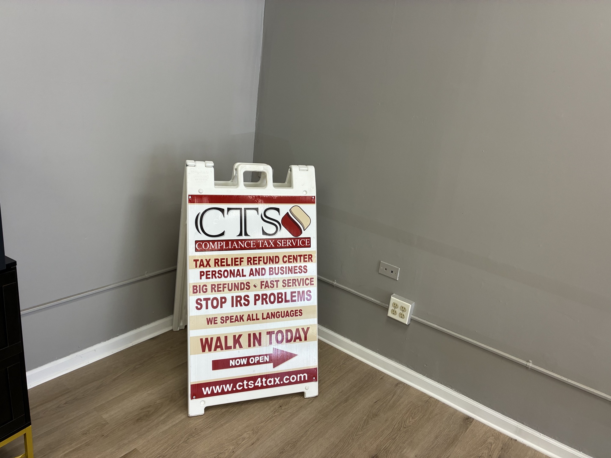 A CTS walk-in signage board inside the Oak Lawn office, listing tax relief and refund services.